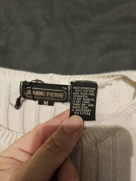 This ivory Jeanne Pierre sweater is a vintage-style piece, likely from the 1990s